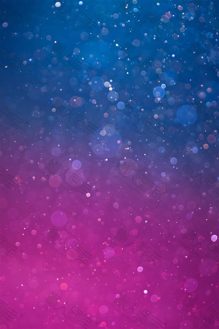 蓝紫光斑粒子背景
